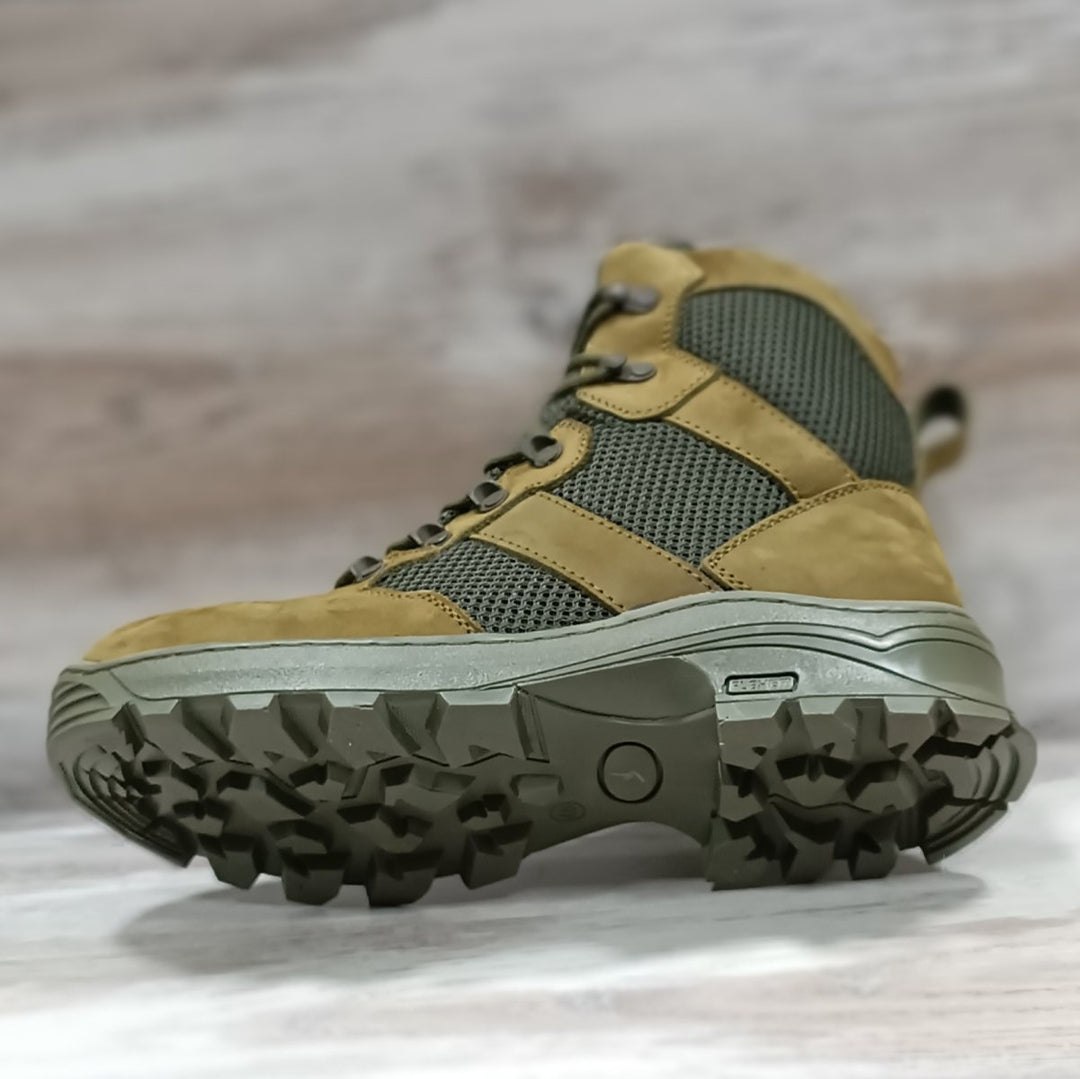 Lightweight olive tactical boots with aggressive trekking outsole and breathable mesh panels, designed for military or hiking use.