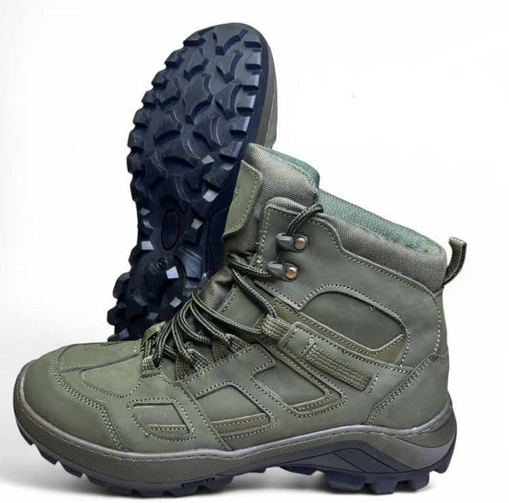 Olive green tactical military boots with rugged black outsole, ankle-high design, reinforced toe and heel, winter or demi-season version