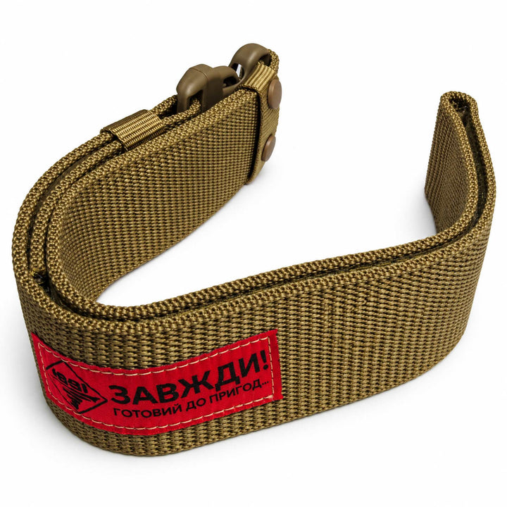 Coyote brown tactical waist belt made from thick nylon webbing, shown folded with a Fastex buckle and red manufacturer label.