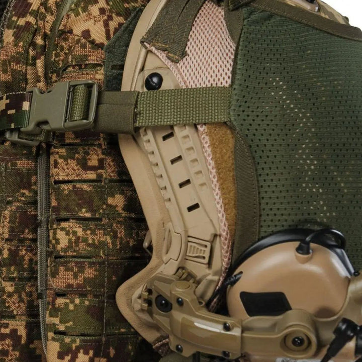 Close-up of helmet holder attachment on Predator camouflage plate carrier with tactical helmet mounted on side
