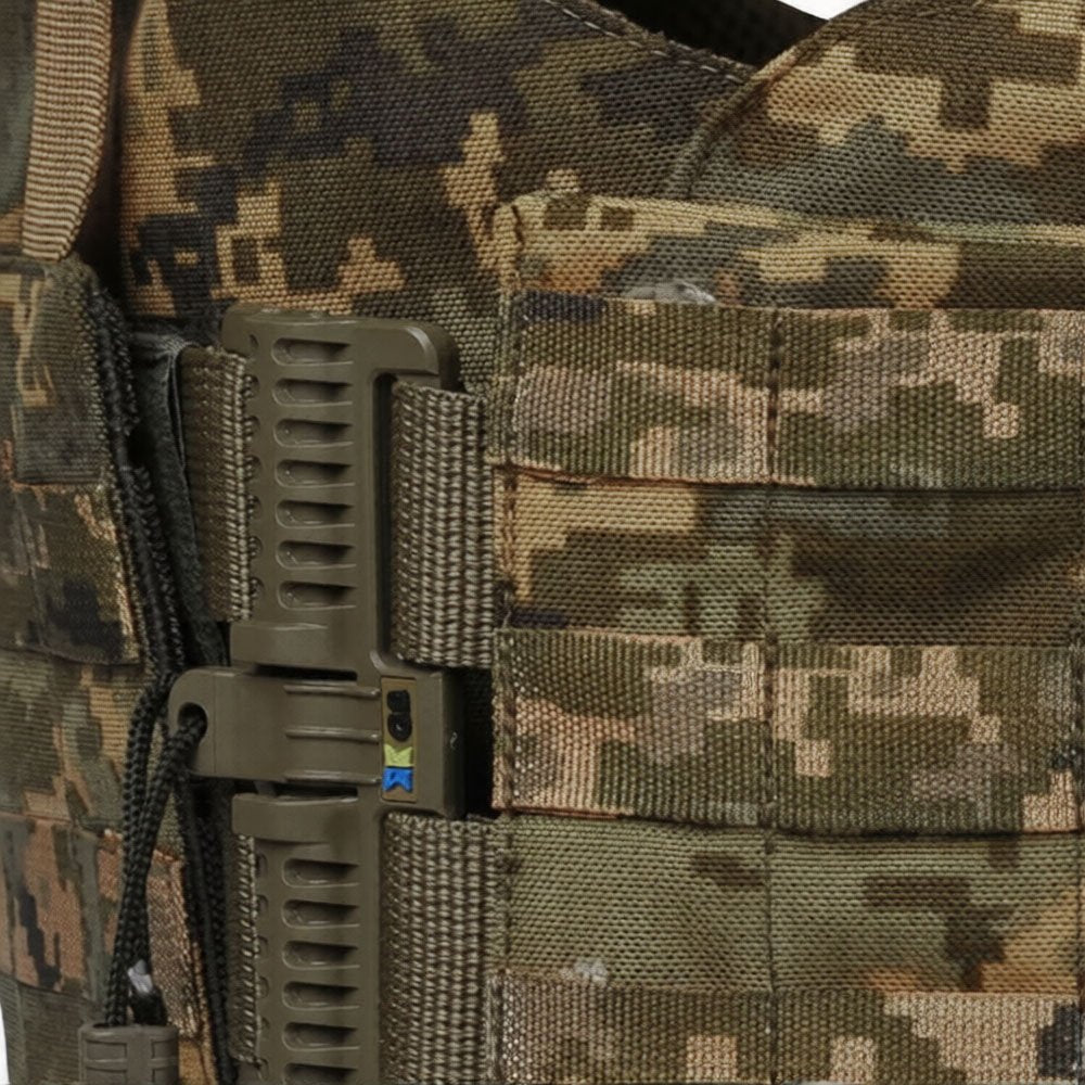 Close-up quick release system on pixel camo tactical vest