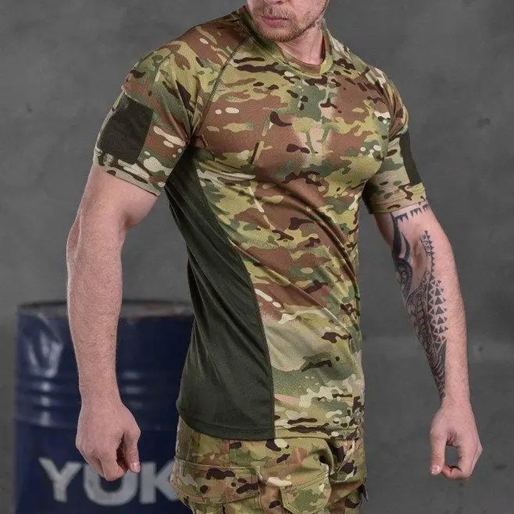 Side view of a man wearing a Multicam tactical t-shirt, highlighting the breathable fabric and ergonomic fit.