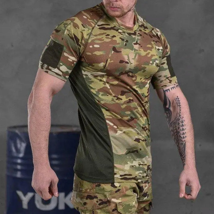 Side view of a man wearing a Multicam tactical t-shirt, highlighting the breathable fabric and ergonomic fit.