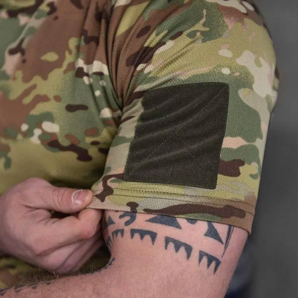 Close-up of the sleeve pocket on a Multicam tactical t-shirt with reinforced stitching.