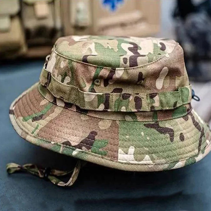Soldier wearing a Ukrainian Army multicam camouflage panama hat with chin strap.