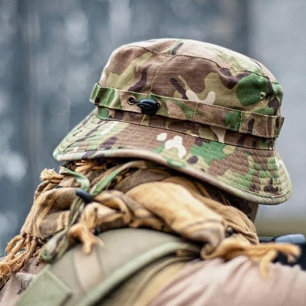 Ukrainian Army multicam camouflage panama hat with chin strap lying on a table.