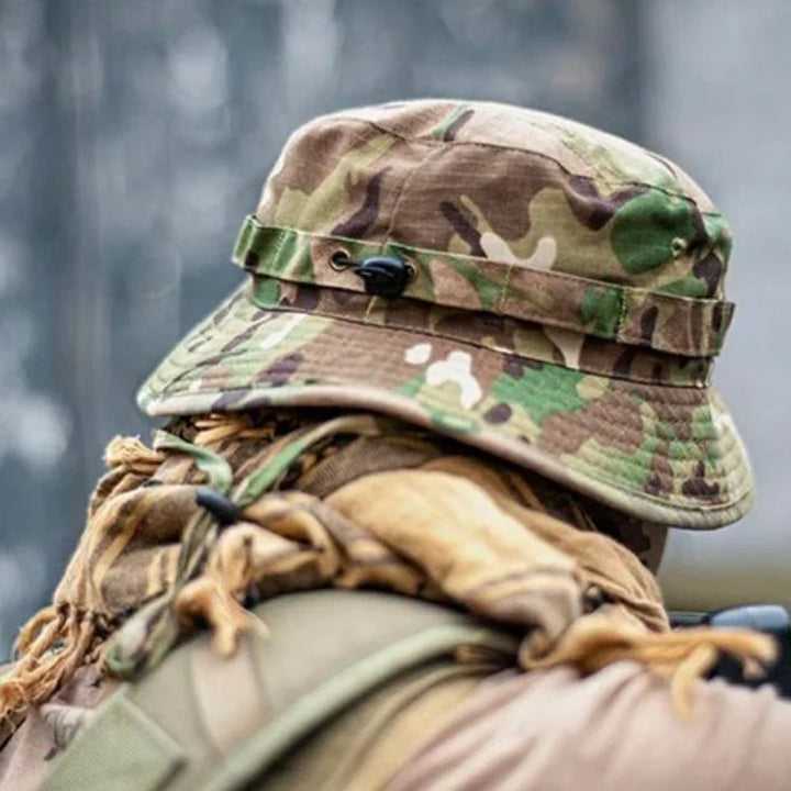 Ukrainian Army multicam camouflage panama hat with chin strap lying on a table.