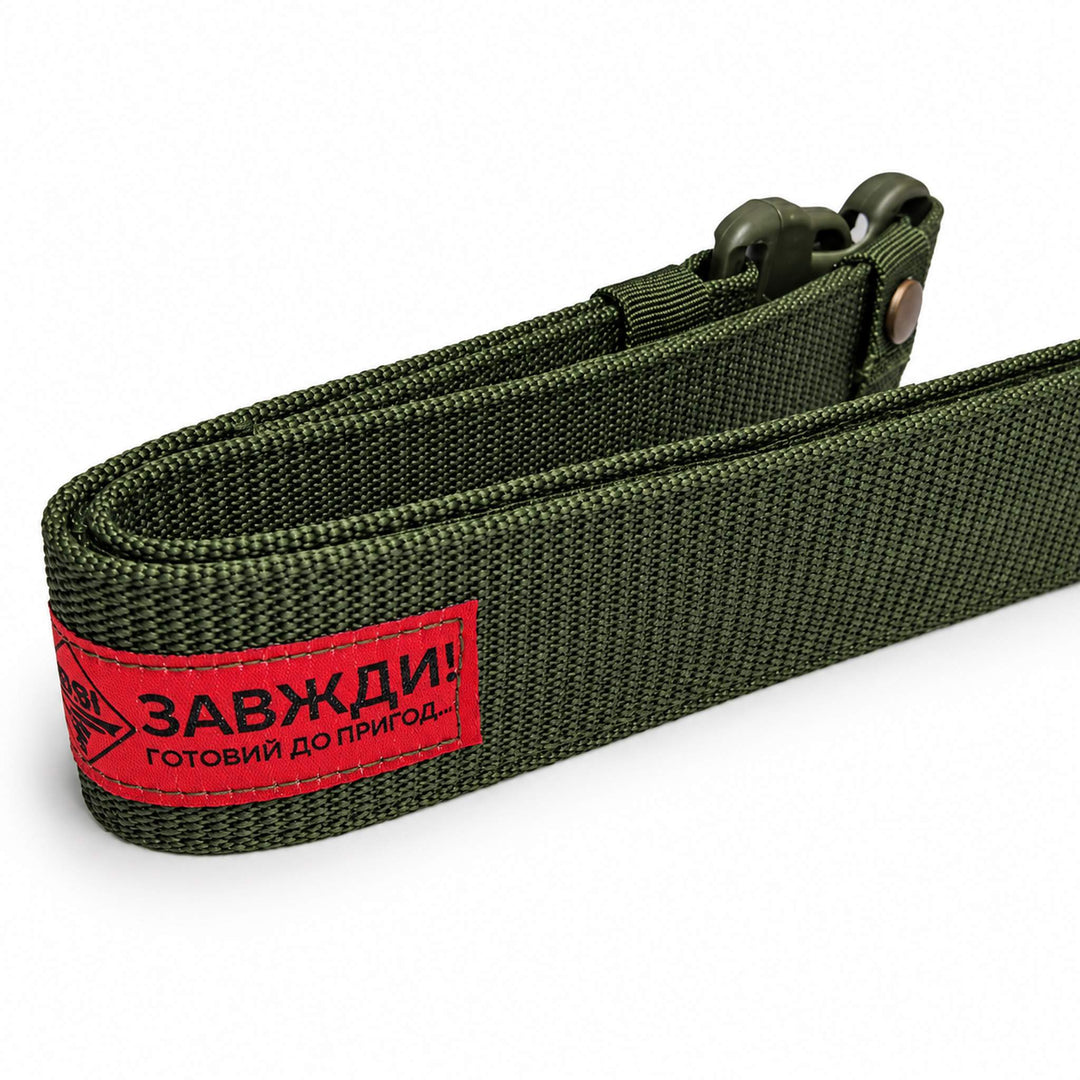 Olive green tactical waist belt showing the thick nylon webbing and red manufacturer label stitched onto the outer side.