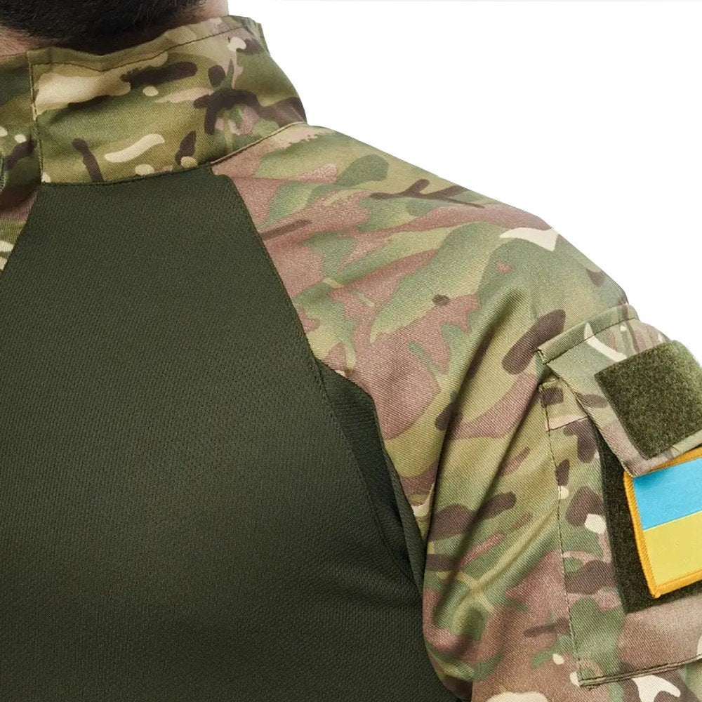 Side view of a man in a UBACS shirt showing the camo sleeve with a velcro patch.