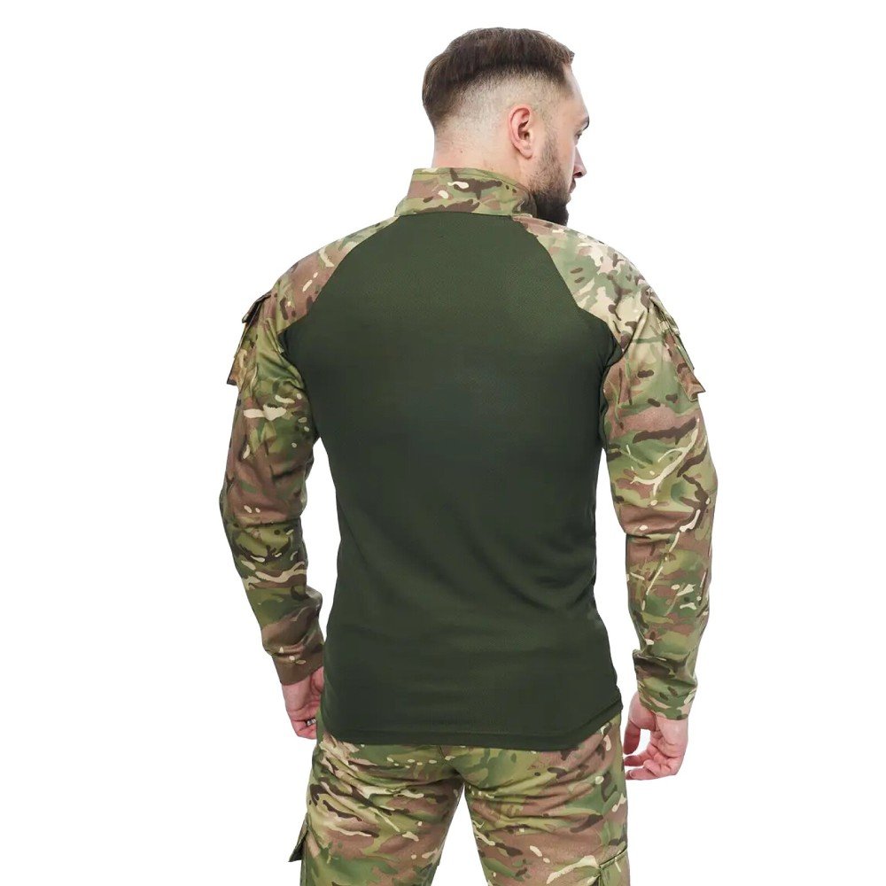 Back view of a man wearing a multicam UBACS shirt showing the seamless integration of the green torso with camouflage sleeves.