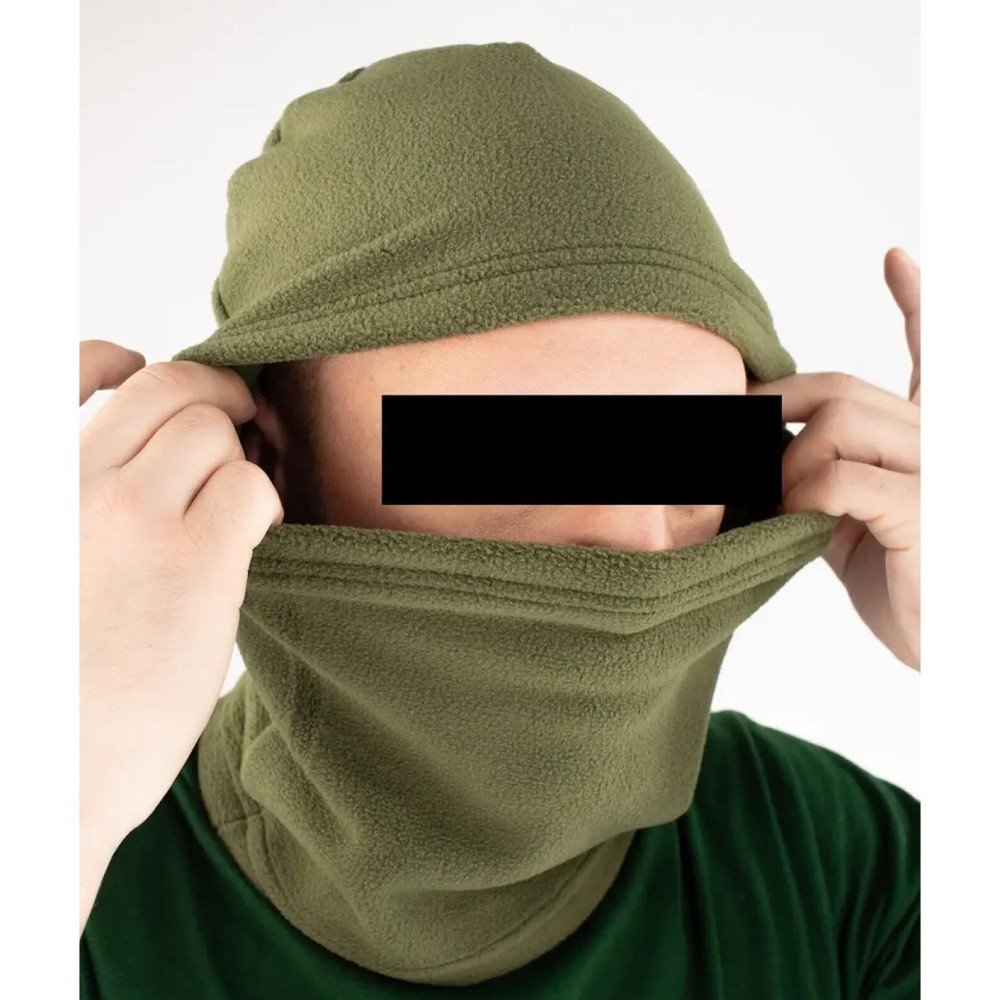 A person adjusting the olive fleece balaclava, demonstrating its flexibility and fit.