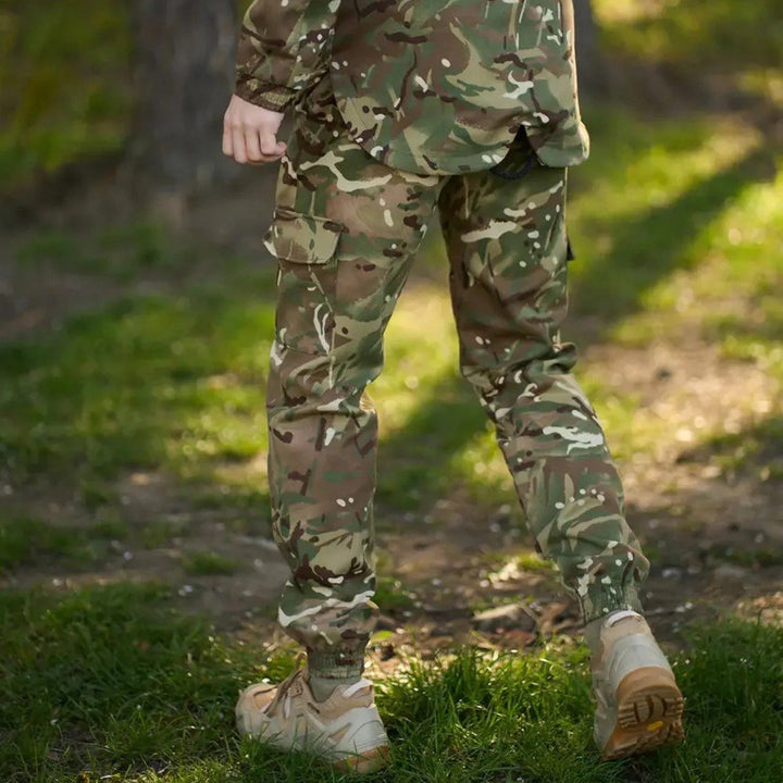 Ukrainian army multicam trousers with cargo pockets in a woodland setting.