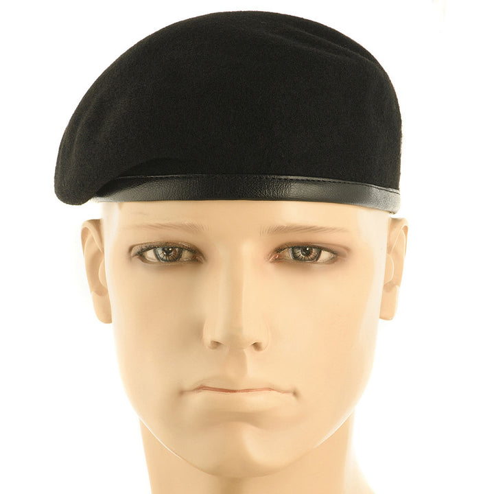 Ukrainian Army black beret worn on a mannequin. Displayed detailed woolen structure and leather edge.