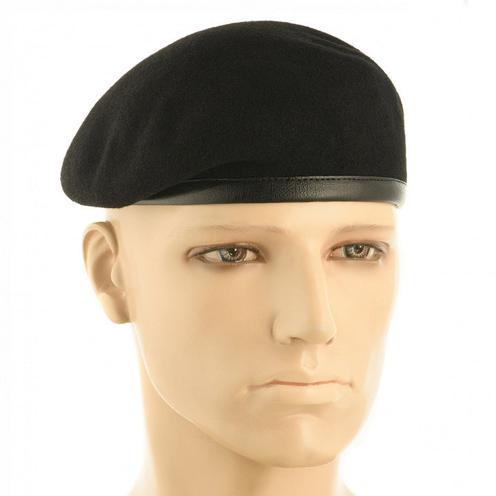Army beret hat made from black natural wool, worn on a mannequin head, with a leather lower band and rounded Tank Forces style.