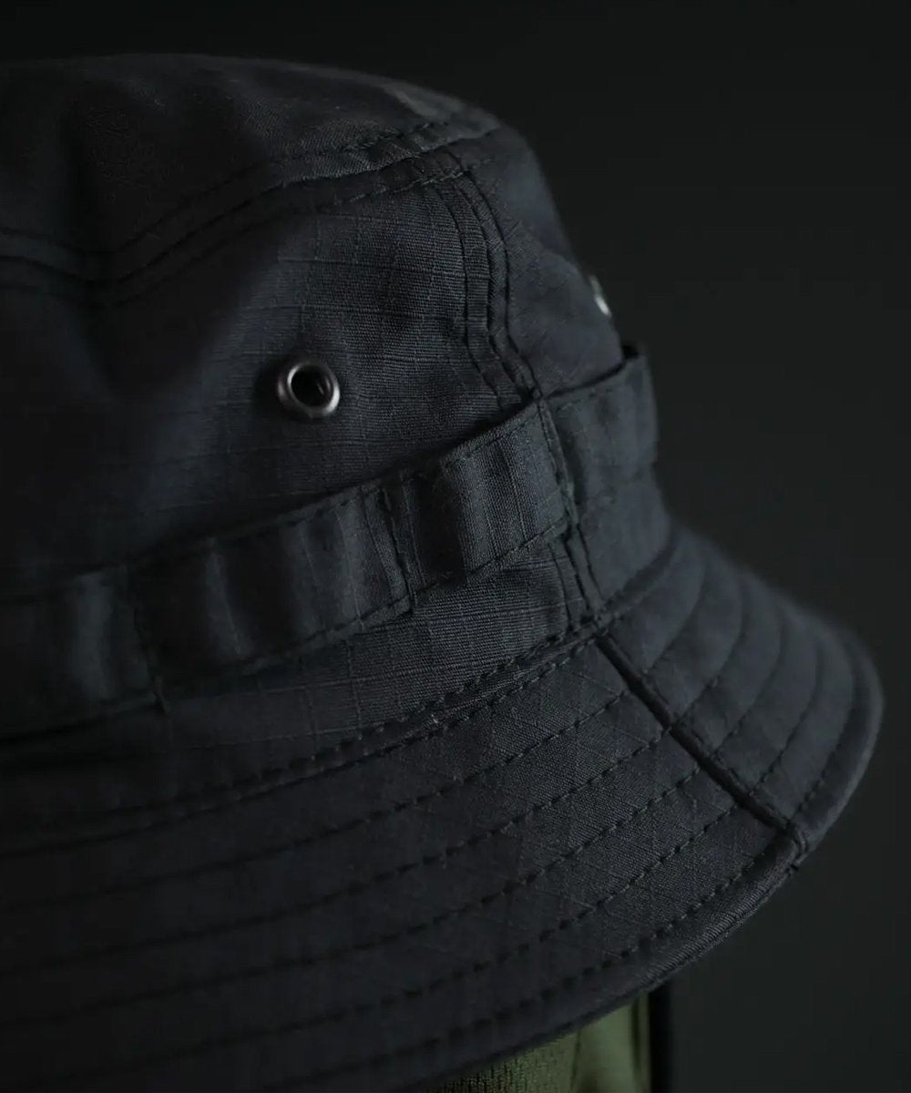Reinforced stitching and metal eyelets on tactical summer hat for breathability