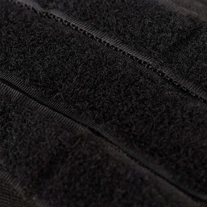 Close-up of the velcro patch area on a black tactical backpack.