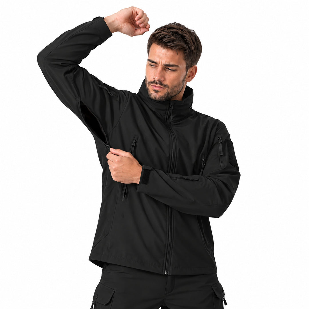 Olive tactical windbreaker with the hood stored inside the high collar, full front zipper, two zippered chest pockets, sleeve pockets, hook &amp; loop panels, and adjustable cuffs.