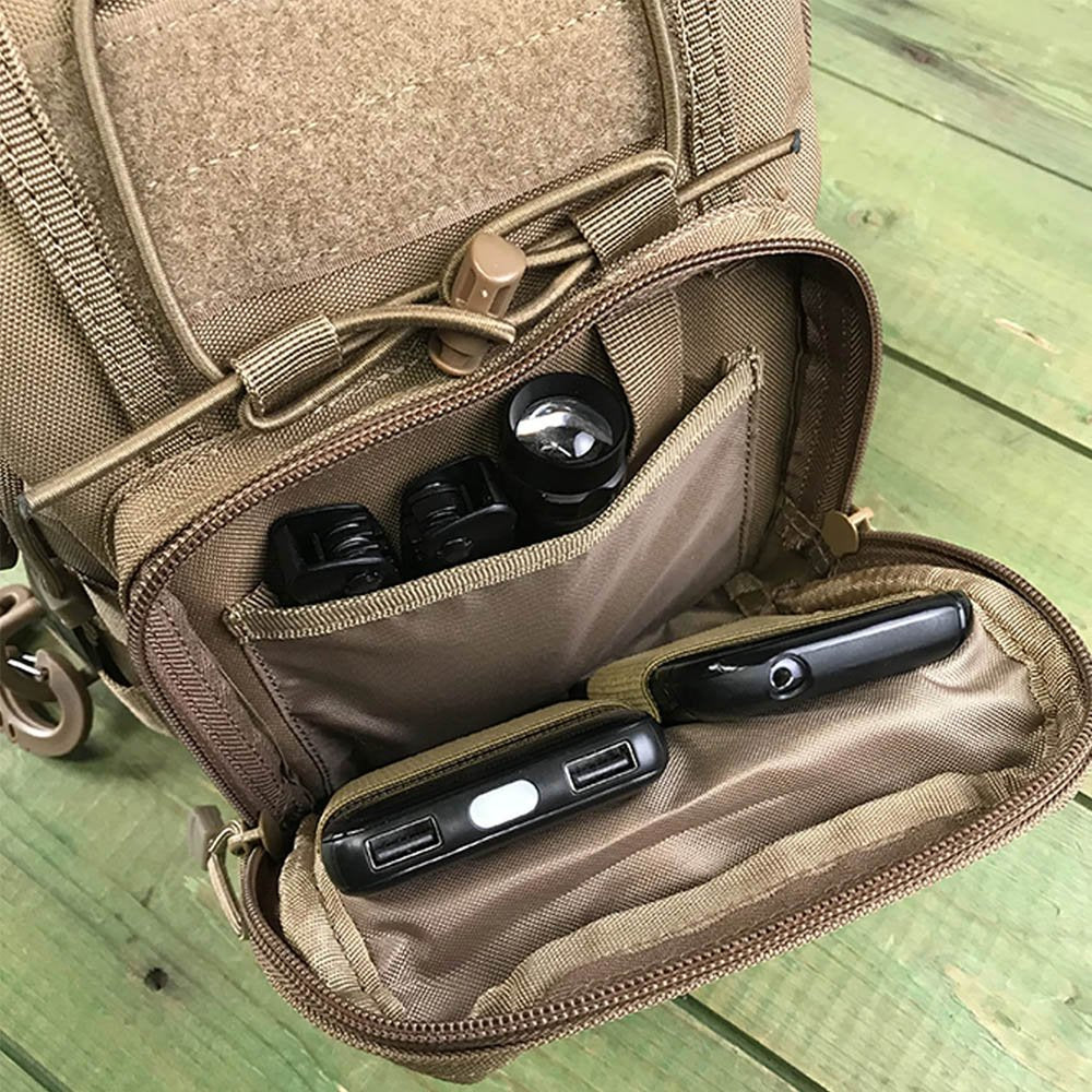 Interior view of a tactical chest bag with personal items and elastic organizers.