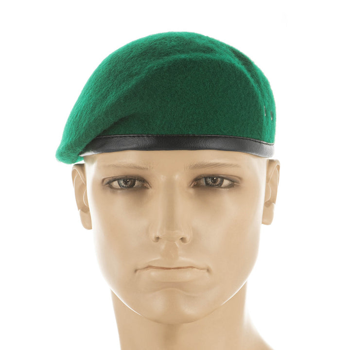 Ukrainian military green beret worn on a mannequin head, showing the natural wool, black leather lower edge, and classic rounded shape.