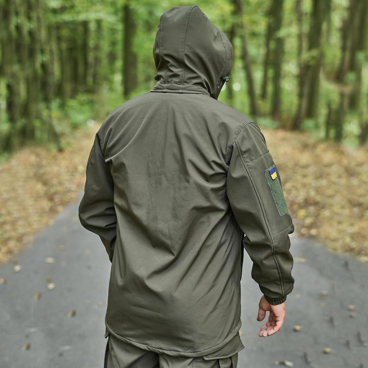 Back view of an olive hooded jacket, showcasing its windproof and waterproof design.