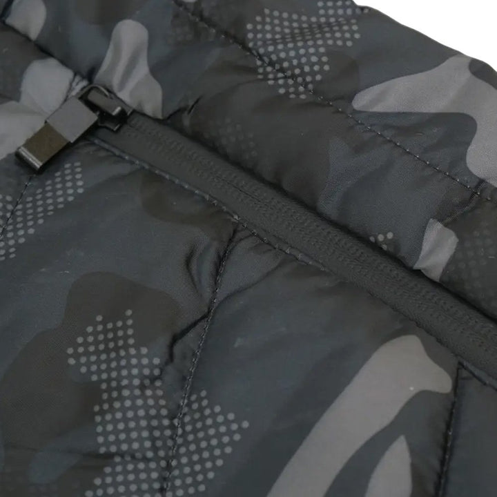 Close-up view of the zipper on an urban camo heated vest