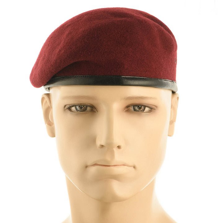 Maroon military beret hat with a classic Airborne Forces shape worn on a mannequin head.