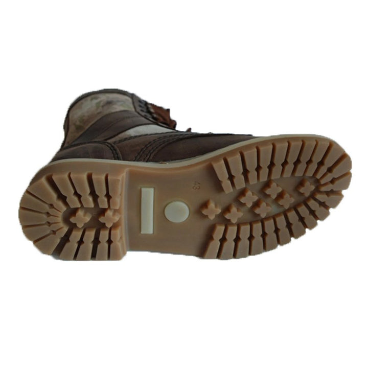 Sturdy sole of moss camo tactical boots for rugged terrain.