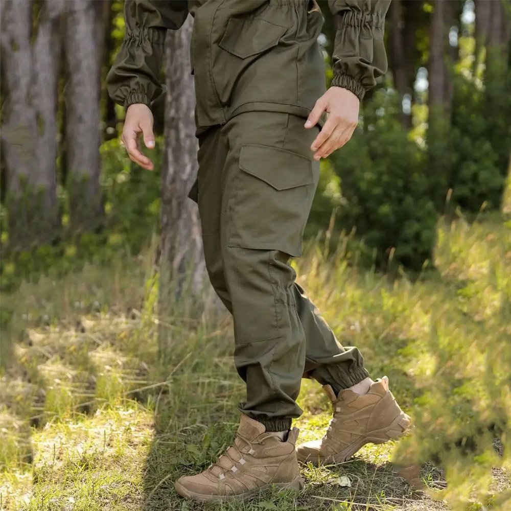 Side angle showing the utility pockets on an olive Gorka tactical jacket.