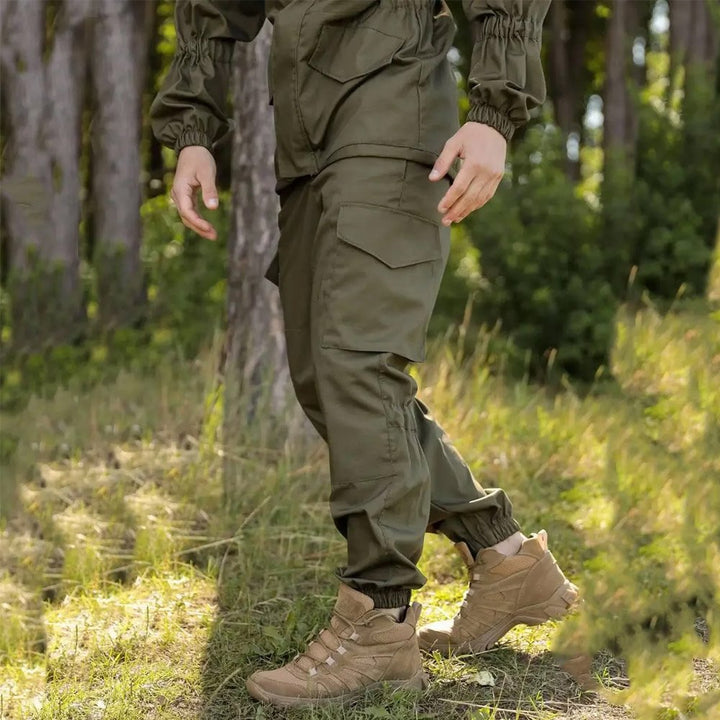 Side angle showing the utility pockets on an olive Gorka tactical jacket.