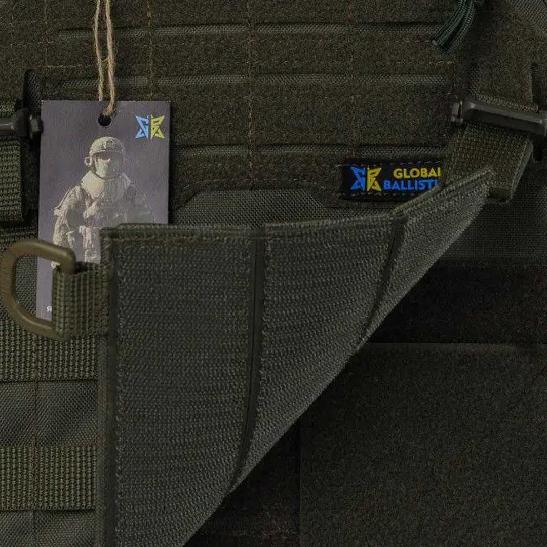 Tactical vest Velcro flap opened, exposing internal stitching and Global Ballistics label