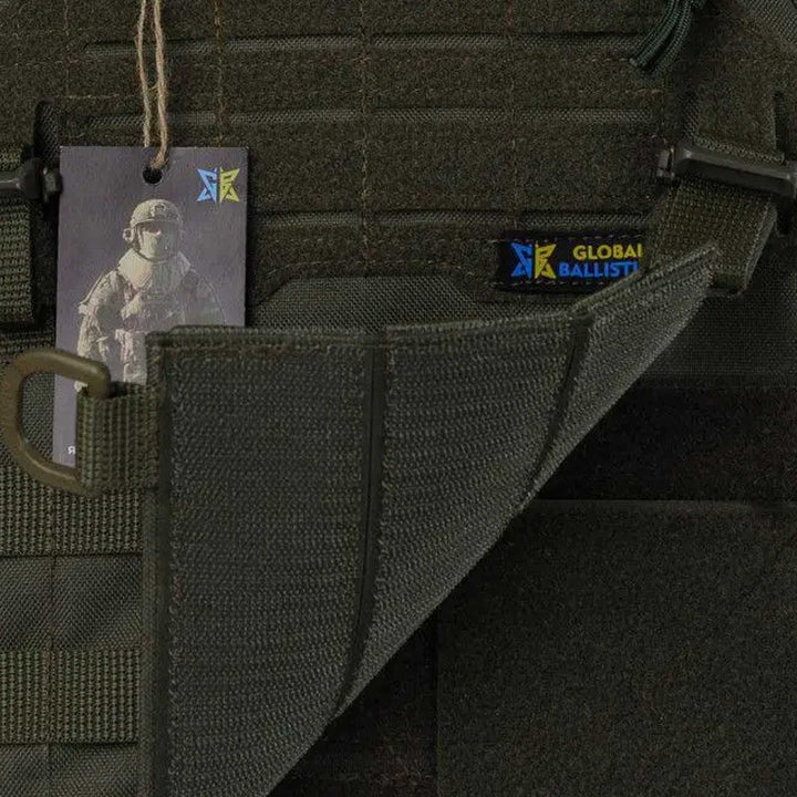 Tactical vest Velcro flap opened, exposing internal stitching and Global Ballistics label