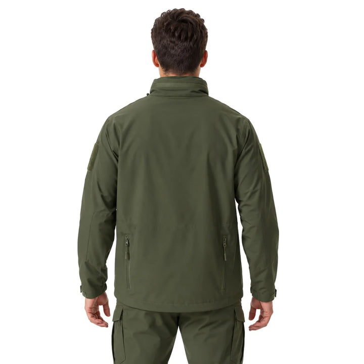 Olive waterproof tactical windbreaker worn from the back, showing the high collar, straight rear panel, sleeve patch areas, adjustable cuffs, and hip-length cut.