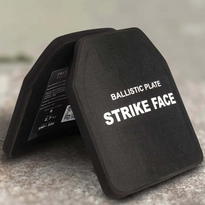 Tactical curved ballistic plates arranged at an angle, showing protective thickness