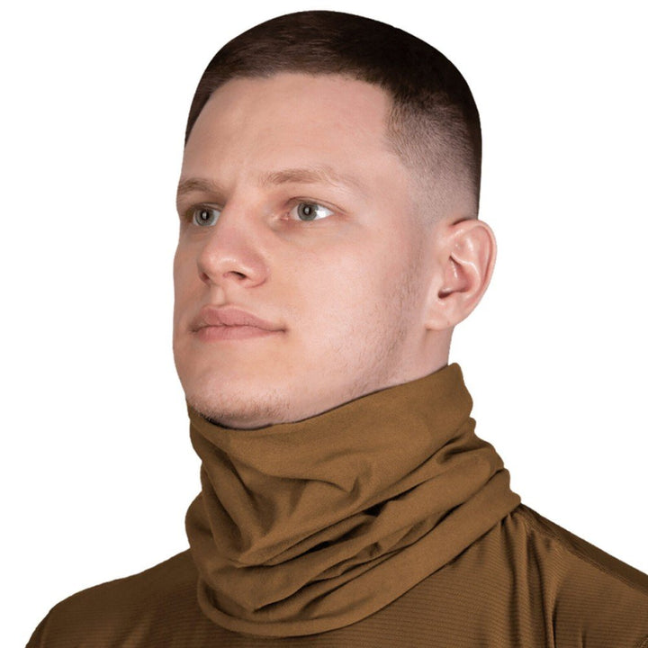 A man wearing a coyote brown tube scarf, designed for neck and face protection.