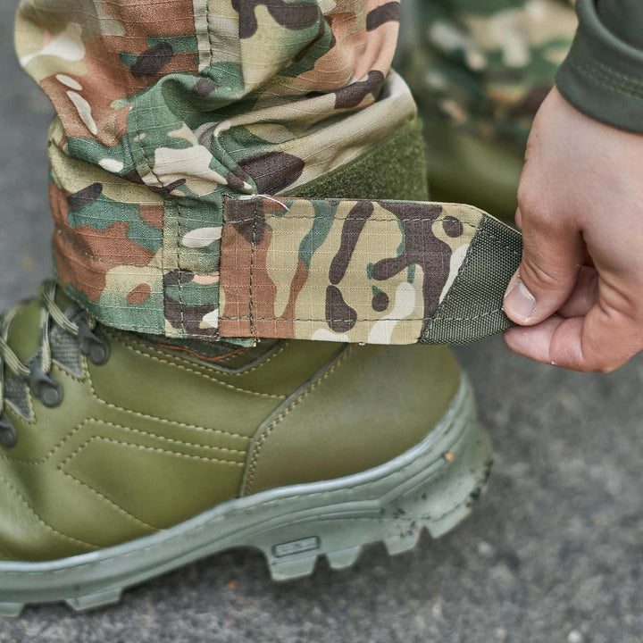 Adjustable ankle straps on Ukrainian army multicam pants for a snug fit.
