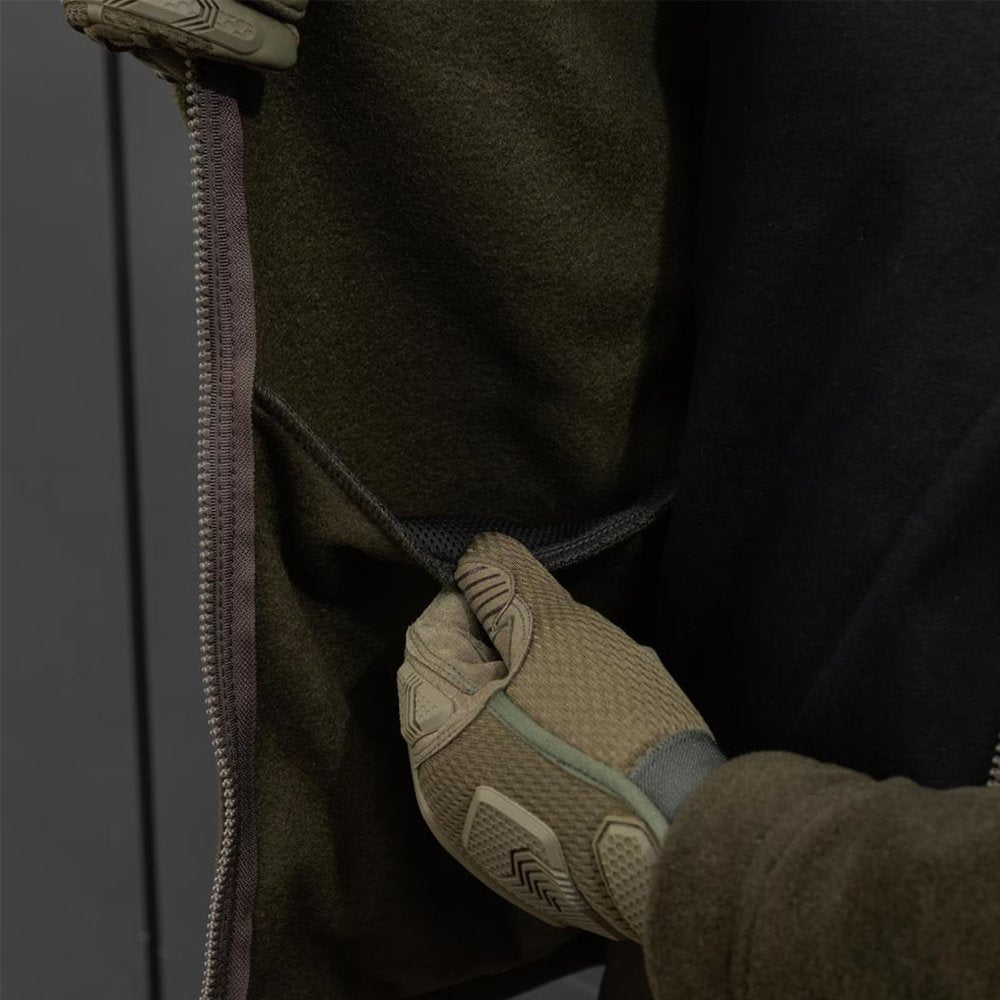 Khaki softshell jacket with zippered sleeve pocket.