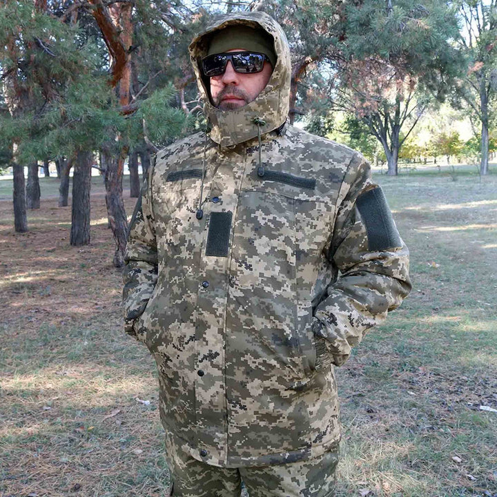 Ukrainian Army winter jacket in MM14 pixel camouflage with adjustable hood and fleece lining, front view.