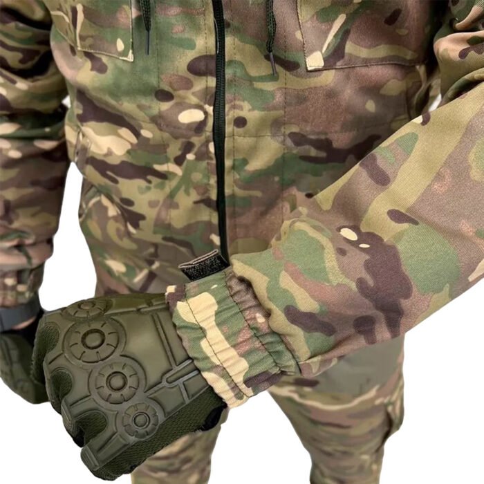 Close-up of a multicam uniform sleeve showing velcro patches for insignia attachment, part of the Ukrainian army standard issue.
