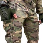 Back pocket design on Ukrainian army multicam camouflage trousers with secure flaps for tactical utility.