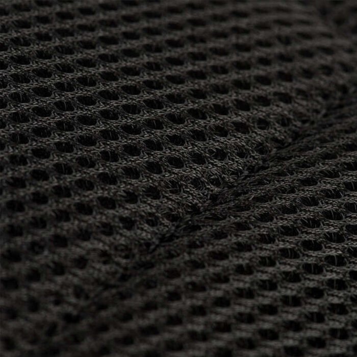 Mesh padding on a black tactical backpack.