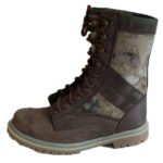 Side angle of moss camo combat boots, displaying craftsmanship.