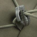 Detailed view of grenade-shaped zipper pull on backpack