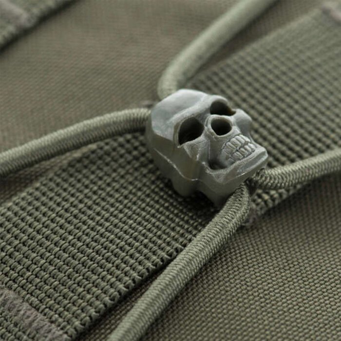 Skull-shaped zipper pull on olive tactical backpack