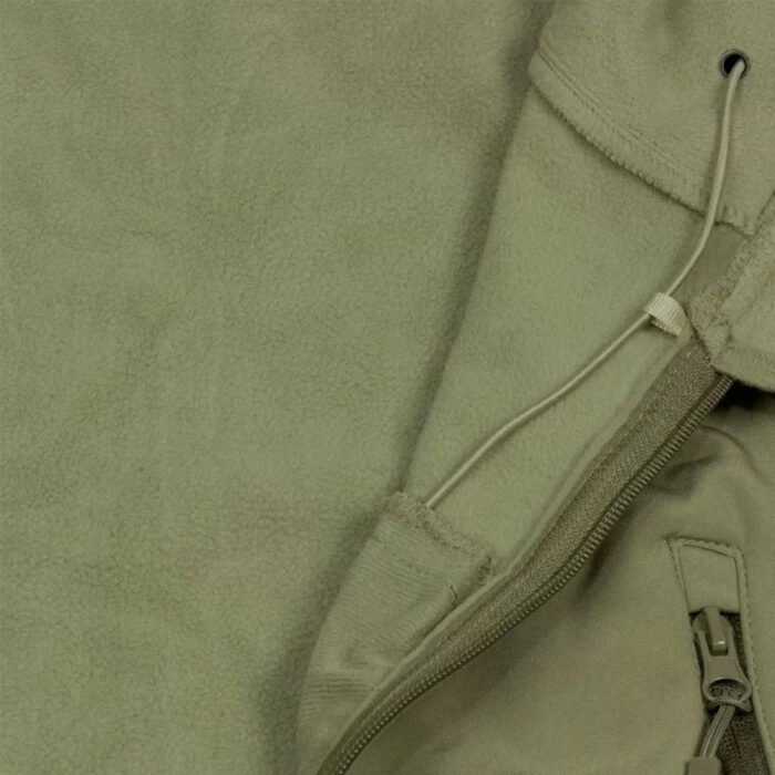 Close-up of the olive jacket's soft fleece lining and sturdy zipper.
