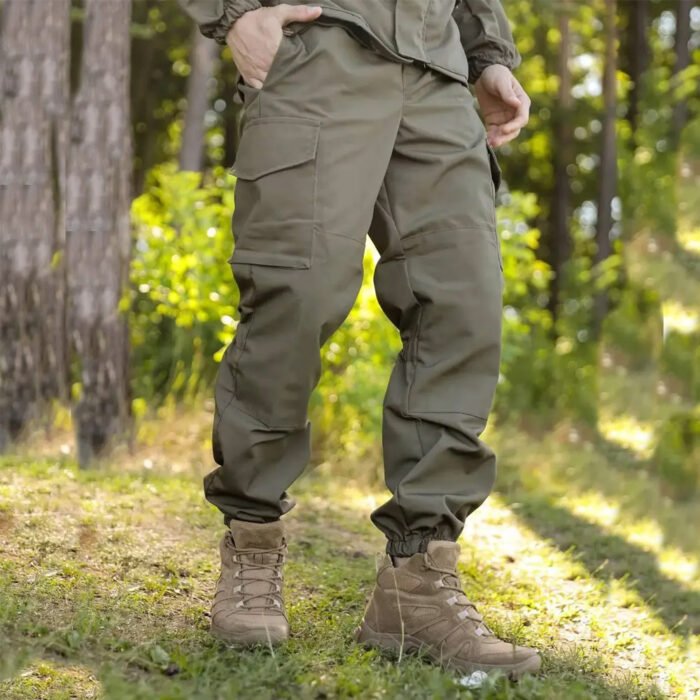 Front perspective of olive Gorka military trousers, part of a tactical suit.