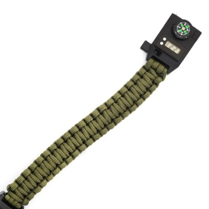 Close-up of a tactical wristwatch strap with a digital display and compass.