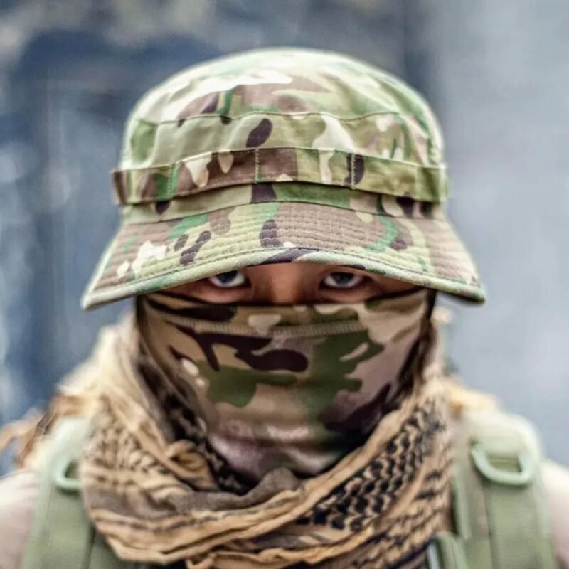 Close-up of a soldier wearing a Ukrainian Army multicam camouflage panama hat and matching face covering.