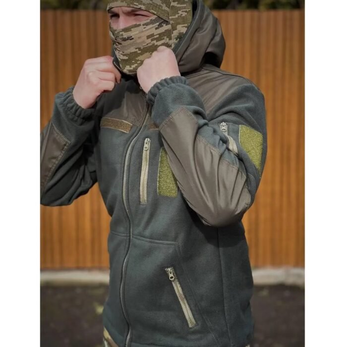 Man adjusting the hood of a military fleece jacket