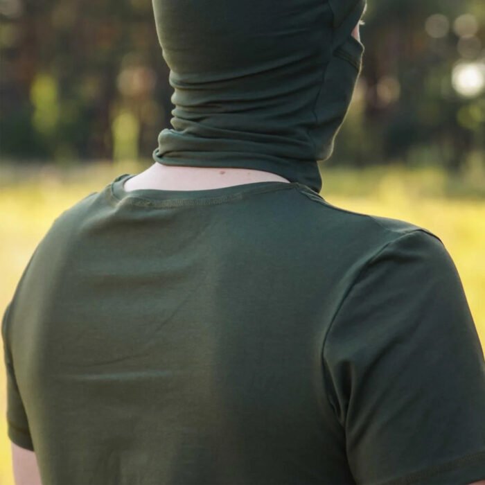 Close-up back view of a man in a khaki t-shirt, highlighting the fabric texture.