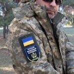 ZSU camouflage jacket with Ukrainian flag patch and fleece insulation for cold-weather use.